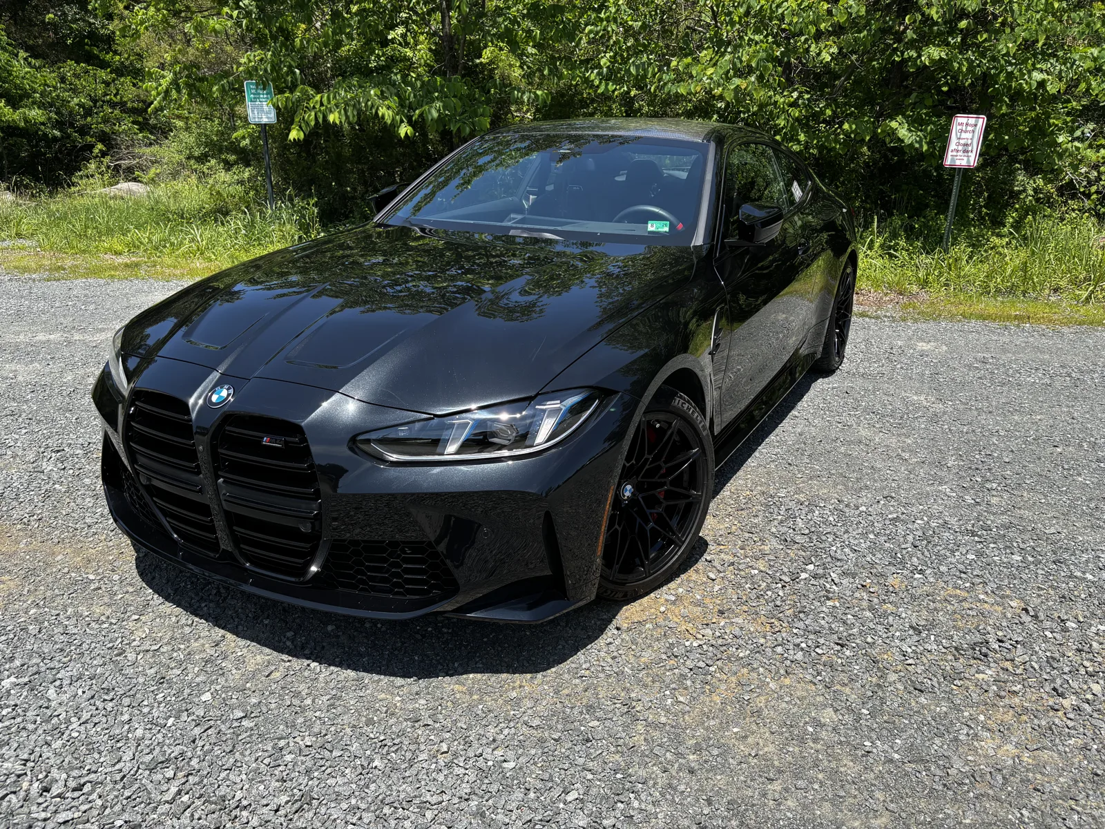 Detailed black BMW coupe with glossy bodywork in the sunlight